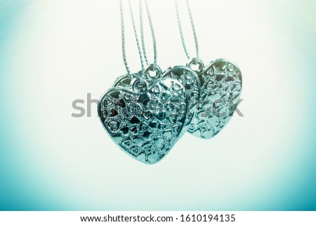 Heart on chain. Three blue hearts. Valentine's Day holiday. Blue hearts for boys and men.