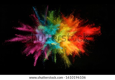 Explosion of colored powder isolated on black background. Abstract colored background Royalty-Free Stock Photo #1610196106