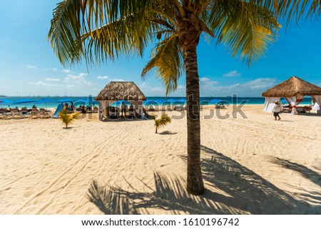 Tropical paradise beach with white sand and coco palms travel tourism wide panorama background. Luxury vacation and holiday banner, tropical beach resort concept. Beautiful beach design