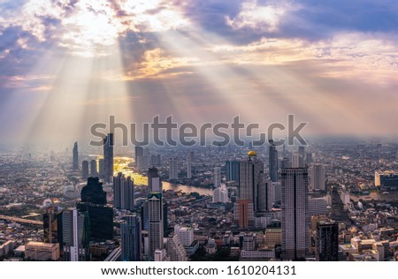 Skyscraper on cityscape at Chaopraya river in Bangkok metropolis Thailand on sunset time