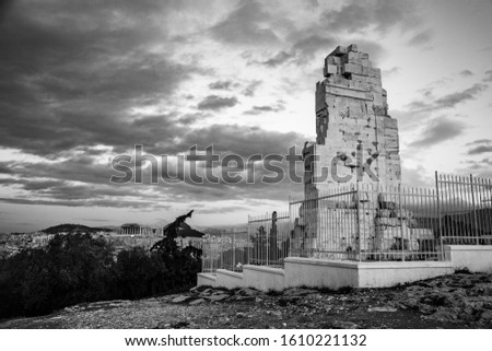 black and white photo of the Philopappu Monument and the Parthenon in background, Greek mausoleum dedicated to Gaius Julius Antiochus Epiphanes Philopappos or Philopappus in Athens, Greec