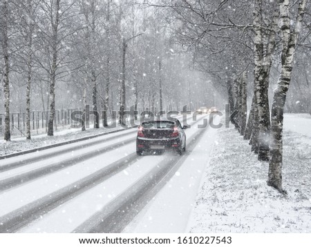 Winter snow road with cars. Winter traffic cars