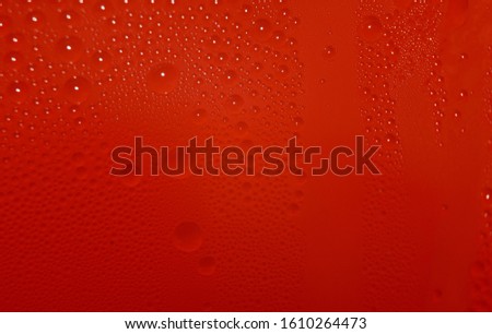 Orange blurred abstract background wallpaper with water drops