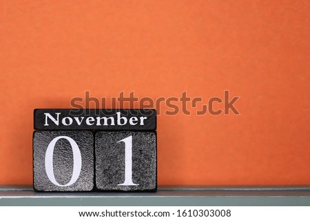 November 1, day 1 of month, calendar on a wooden cubes