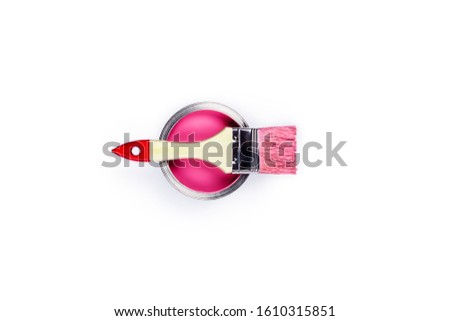 Renovation picture. Isolated white background with one pink pain cans and brush located on it. Flat lay, top view, copy space.