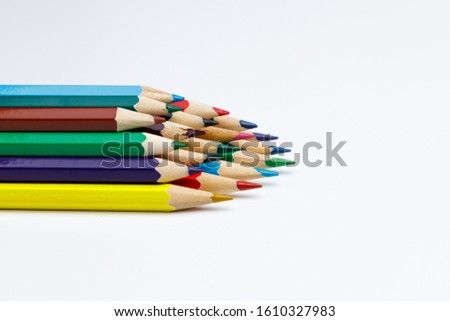 color pencils stacked with withe space for custom text, for powerpoint presentations or websites