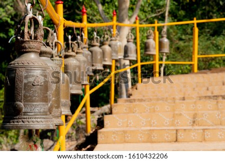 The bells are lined up to level in temple at Thailand.