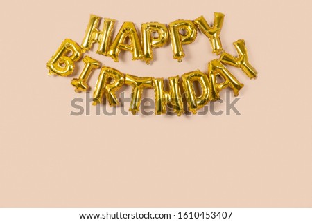 Gold Balloons happy birthday.Happy Birthday to you logo, card, banner, web, design. Birth day card. Gold balloon on beige color  background.