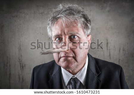 Dishonest puppet business man with a long wooden nose, liar concept Royalty-Free Stock Photo #1610473231