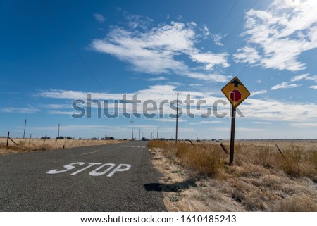 Traffic Sign On Side of Two Way Road With Clear Bright Skies
