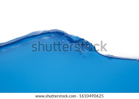 The surface of blue water that is splattered or moving