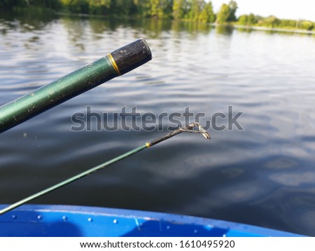 Fishing material and equipment pictured from boat in lake water