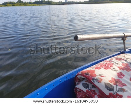 Fishing material and equipment pictured from boat in lake water