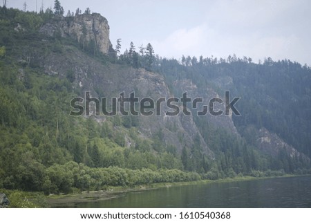 landscape of forest reserve with mountains and river