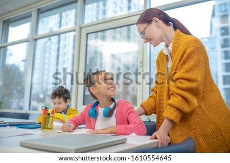 The need to be appreciated. A smiling teacher praising schoolgirl for her efforts Royalty-Free Stock Photo #1610554645