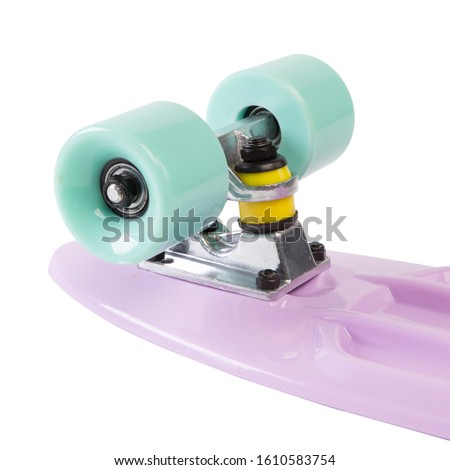modern colorful skateboard - pennyboard isolated on white, wheels close up