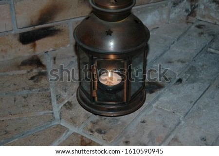 Old lantern with a reso lighting the place