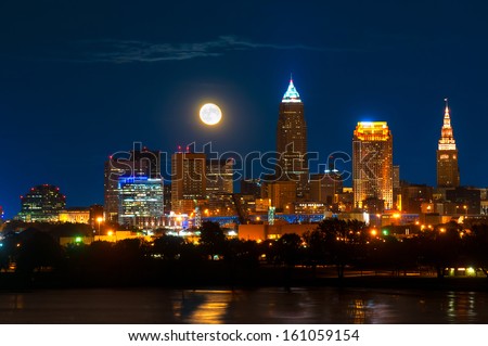 Brightly lit Cleveland Ohio under a just risen full moon