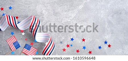 Happy Presidents day sale banner mockup. American flags, grosgrain ribbon, confetti stars on concrete stone. USA Memorial day, Veterans day or Independence day concept.