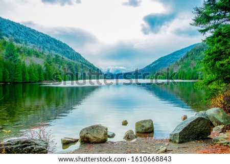 body of water between two hills Royalty-Free Stock Photo #1610668843