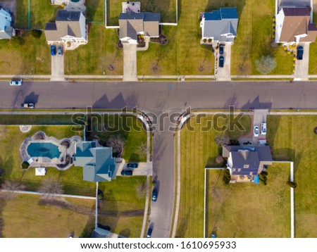 Aerial view of house and intersection Royalty-Free Stock Photo #1610695933
