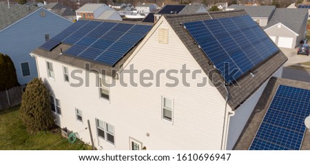 House with solar panels on the roof Royalty-Free Stock Photo #1610696947