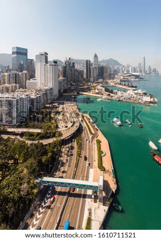 Aerial view of the highway along the Causeway Bay shopping district in Hong Kong island by Victoria harbor