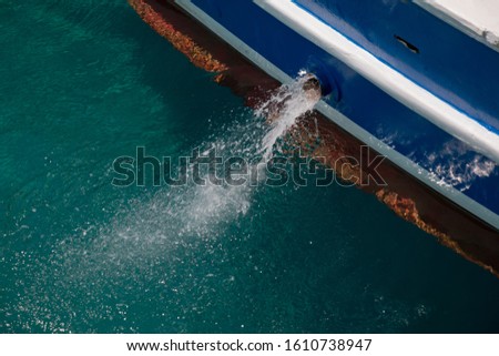 boat on the sea unloading bilge Royalty-Free Stock Photo #1610738947