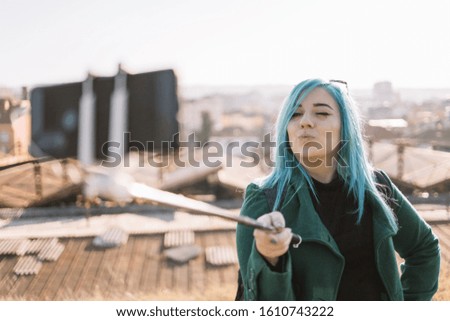 Smiling girl taking selfie and showing peace sign