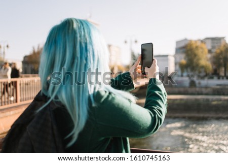 Girl taking a photo of a map