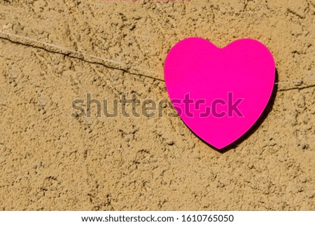pink love heart for st valentines day. Wall background sunny day. space for text. inovative idea for card