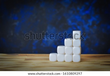 wooden cubes on table background, for including a business messa