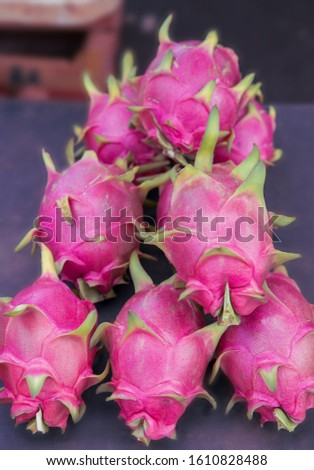 Close up of group dragon fruit for sale in a market.