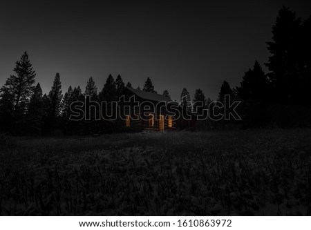 Old shack at night in winter Royalty-Free Stock Photo #1610863972