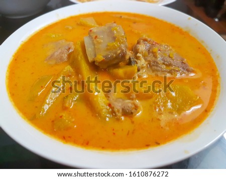 Pork and Pumpkin red curry ,Thai Food. Royalty-Free Stock Photo #1610876272