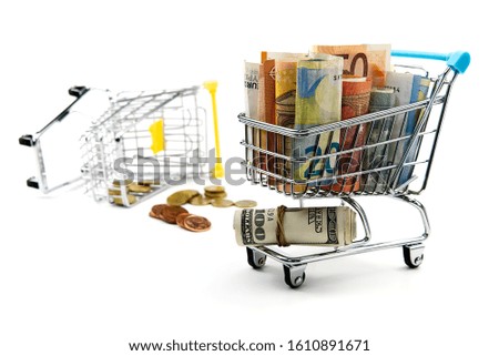 Closeup of a shopping cart full of euro banknotes isolated on white. concept: loan, investment, pension, saving money, financing, collateral, debt, mortgage, financial crisis or rise, rise or fall of