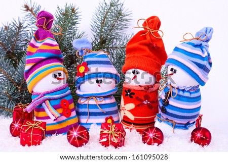 composition with Christmas snowmans and red bauble fir branches isolated on white background