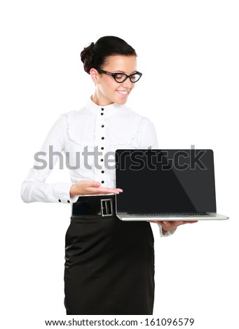 Young beautiful woman showing a laptop, isolated on white background