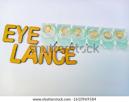 Eye Lance Text written on light background with arrange eye lance 