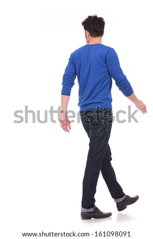 back view of a walking casual man looking to a side on white background