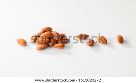 a pile almond in a white background