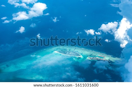 Amazing top view of Maldive Island clouds and beautiful atolls resorts best place to see in the world maldive holiday packages