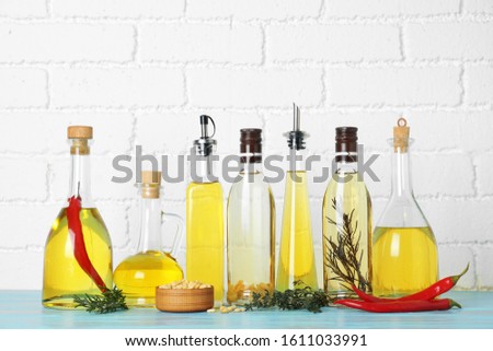 Different cooking oils on blue wooden table