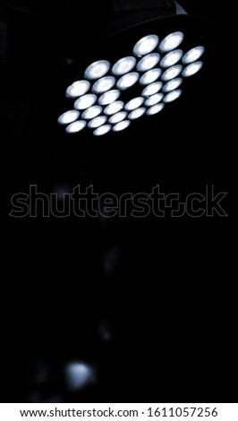 Lighting in a corridor in a house or coffee shop and factory attached above the head, blue light bokeh.