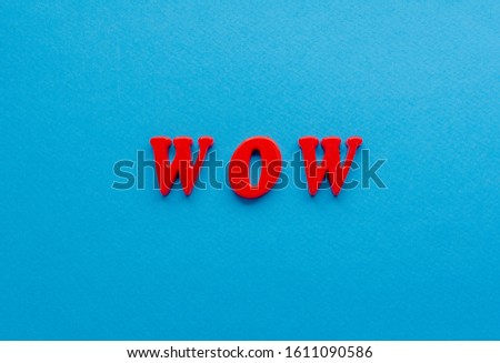  red wow on  blue paper background