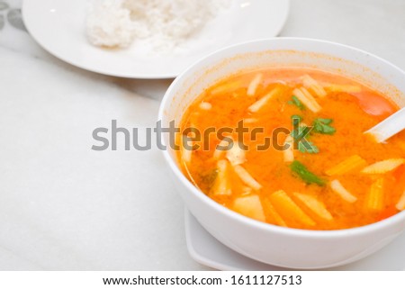 Photo of Seafood Tomyam soup in the white bowl - Thai food