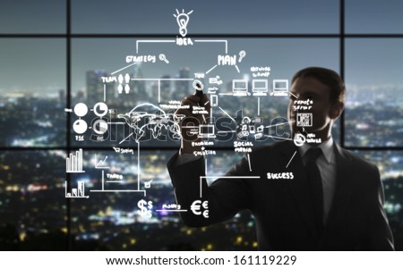 businessman drawing interface in night office Royalty-Free Stock Photo #161119229