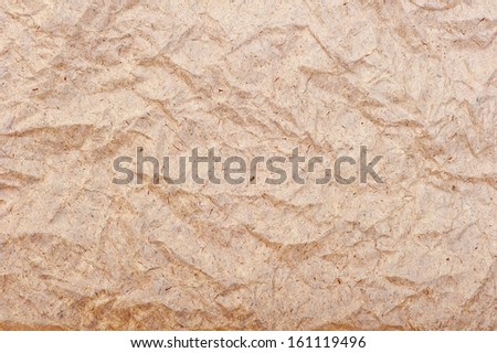 old wrinkled brown paper close-up, background