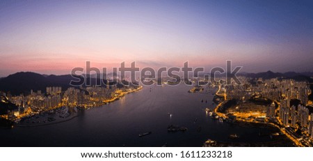 Aerial panorama of the sunset over Hong Kong island and the Victoria harbor from the Devil's peak in Kowloon