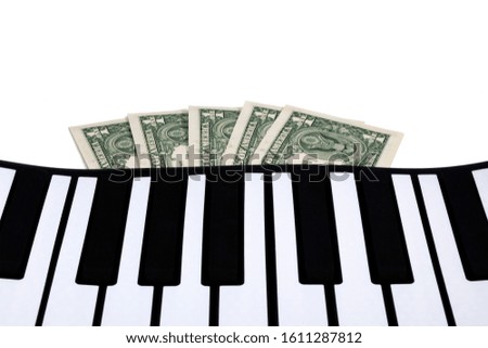 Musical keys with dollars sticking out from under them. White background.